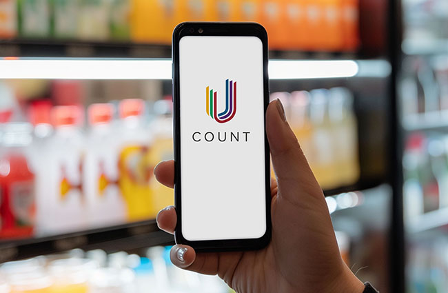 Hand-holding mobile phone with blank screen isolated on drinks c Hand-holding mobile phone with blank screen isolated on drinks c